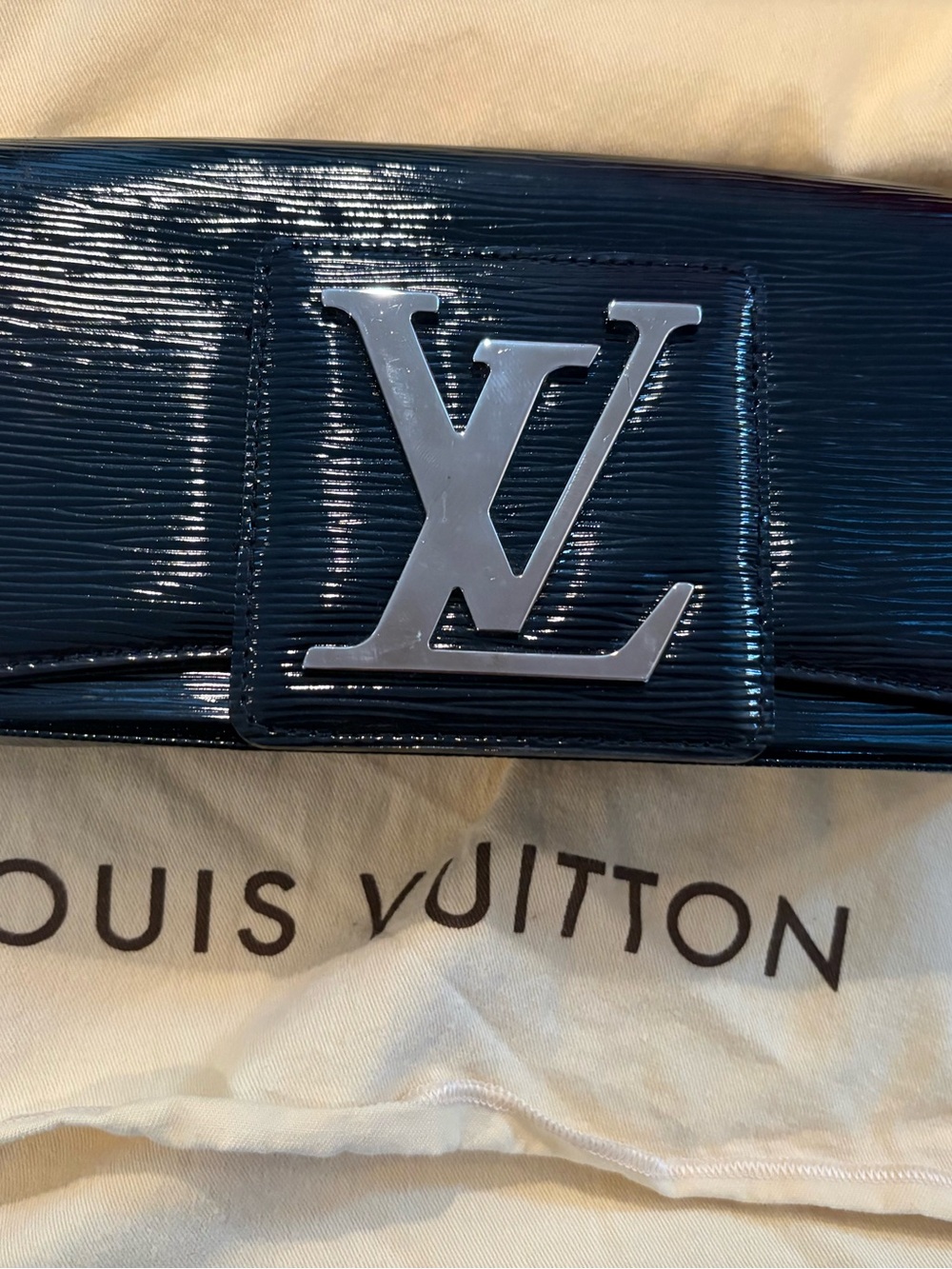 Louis Vuitton Patent Leather Clutch in black with Silver LV Logo